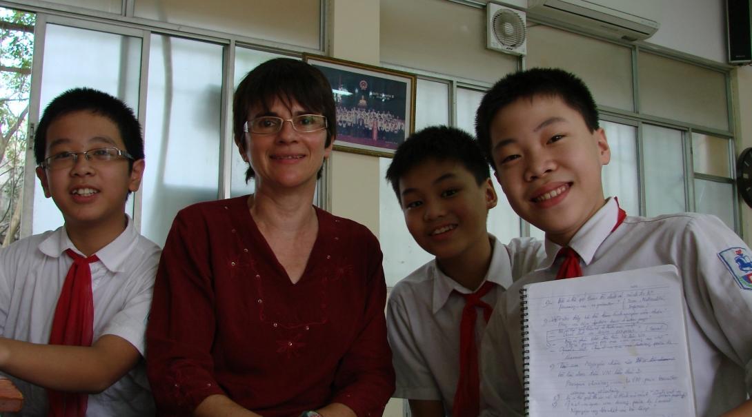 Students and a volunteer at the volunteer teaching placements in Vietnam Young students take a photo with the Projects Abroad volunteer gaining teaching work experience in Vietnam